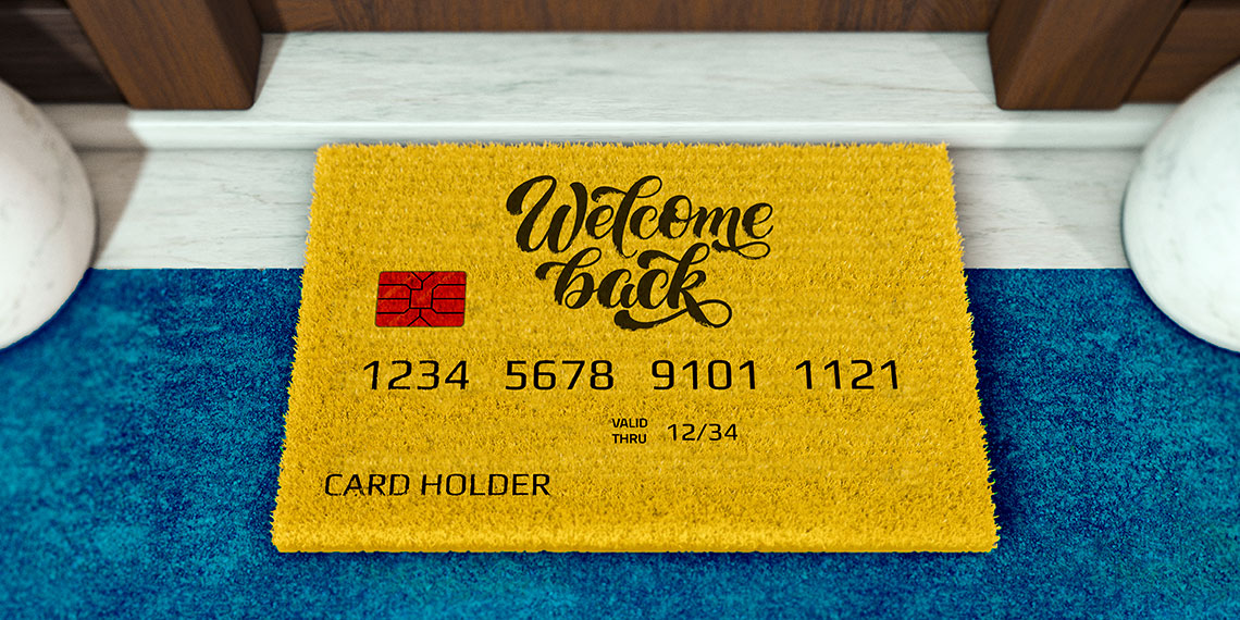 Welcome mat in the shape of a credit card that reads