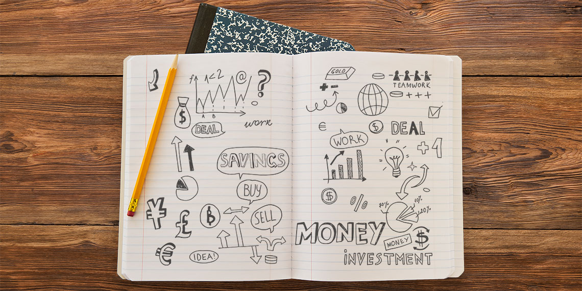 Student composition notebook with different savings terms and graphics.
